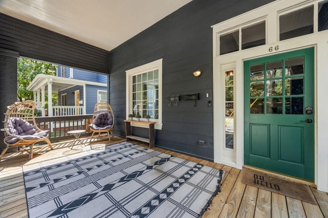 wooden terrace featuring covered porch