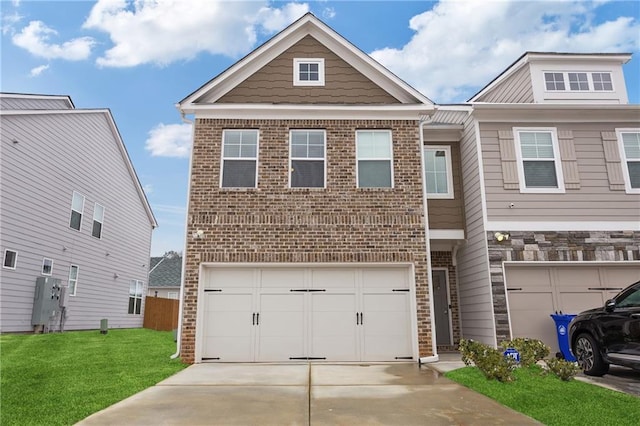 view of front of property featuring a garage and a front lawn