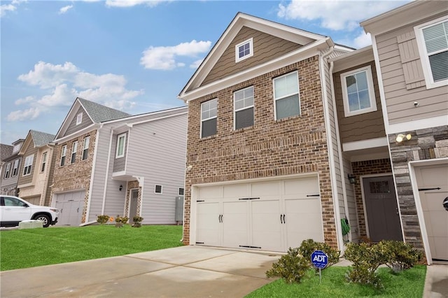 view of property with a front yard and a garage