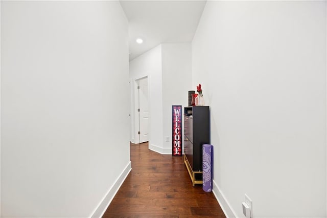 corridor featuring dark hardwood / wood-style floors