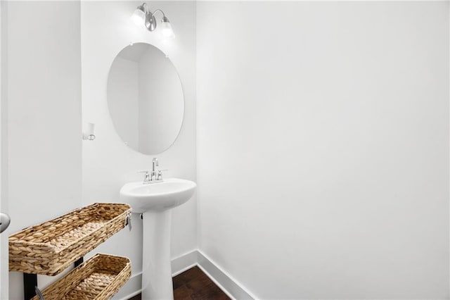 bathroom featuring sink and hardwood / wood-style floors