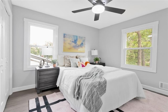 bedroom with hardwood / wood-style flooring and ceiling fan