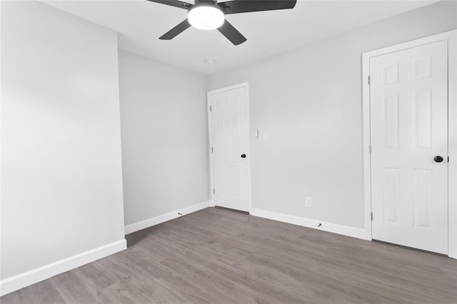 spare room with hardwood / wood-style floors and ceiling fan