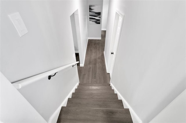 stairway featuring hardwood / wood-style floors