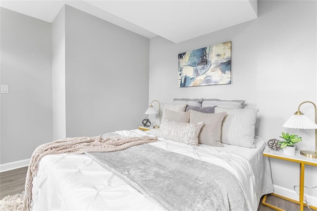 bedroom with hardwood / wood-style floors