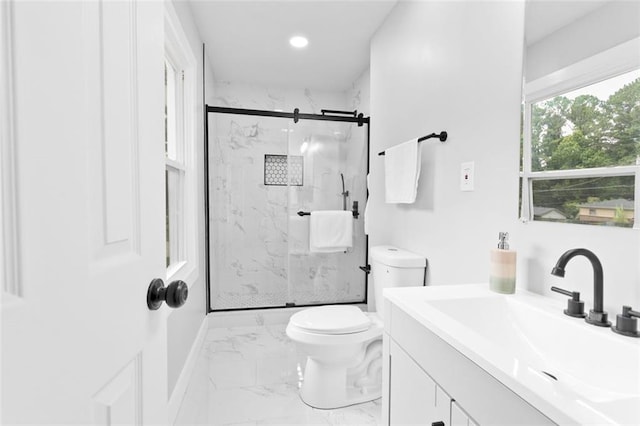 bathroom featuring vanity, an enclosed shower, and toilet