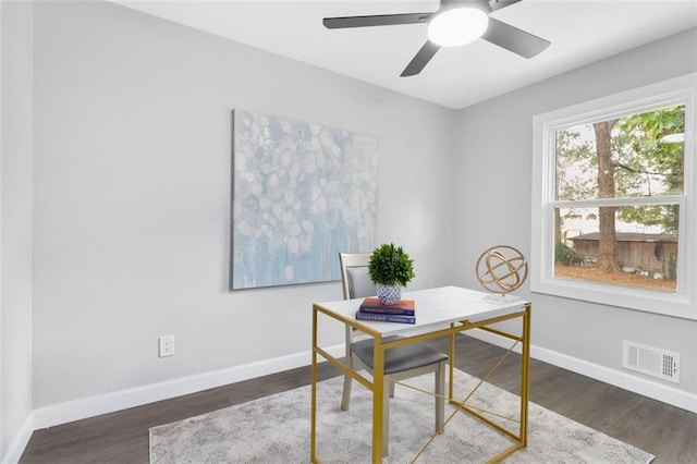 office space with dark wood-type flooring and ceiling fan