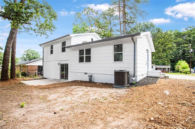 back of house featuring central AC and a patio area