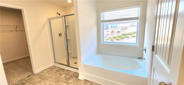 bathroom featuring plus walk in shower