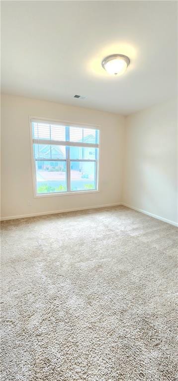 spare room featuring carpet