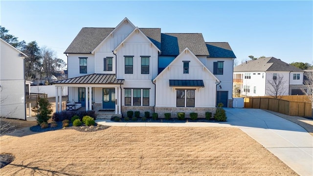 modern farmhouse style home with covered porch