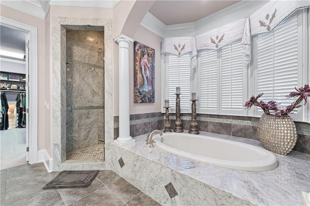 bathroom featuring a garden tub, ornamental molding, a shower stall, tile patterned floors, and ornate columns