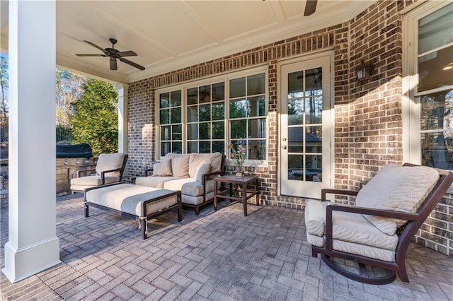 view of patio / terrace with a ceiling fan, an outdoor living space, and area for grilling