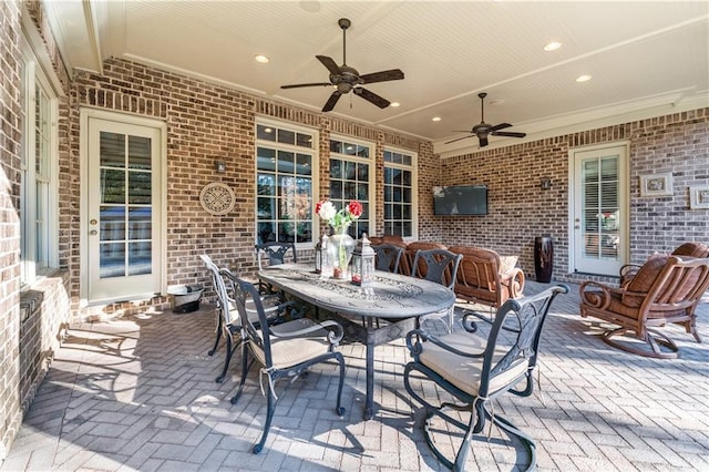 view of patio / terrace with ceiling fan and outdoor dining area