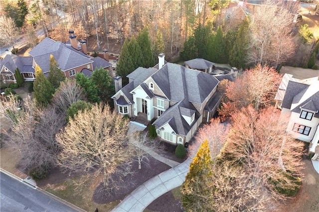 bird's eye view featuring a residential view and a forest view