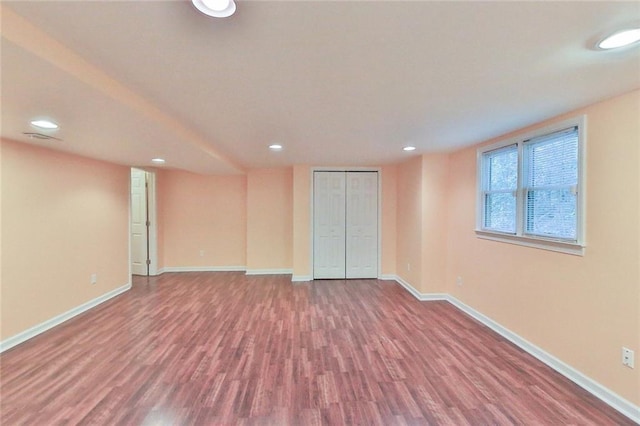 empty room with hardwood / wood-style floors