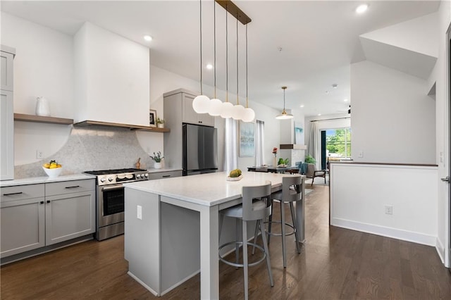 2347 Hosea L Williams Dr NE Unit 11, Atlanta, GA 30317 - kitchen with appliances with stainless steel finishes, gray cabinets, a kitchen island, dark wood finished floors, and recessed lighting