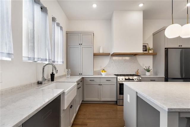 2347 Hosea L Williams Dr NE Unit 11, Atlanta, GA 30317 - kitchen featuring appliances with stainless steel finishes, open shelves, gray cabinetry, tasteful backsplash, and light stone counters