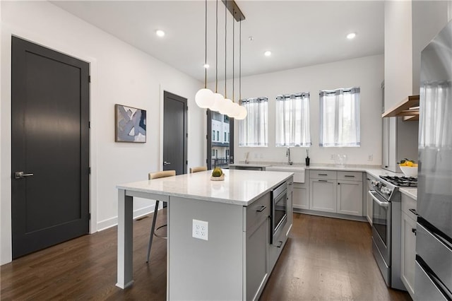 2347 Hosea L Williams Dr NE Unit 11, Atlanta, GA 30317 - kitchen with appliances with stainless steel finishes, dark wood-type flooring, a kitchen bar, plenty of natural light, and recessed lighting