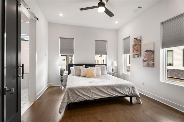 2347 Hosea L Williams Dr NE Unit 11, Atlanta, GA 30317 - bedroom with a barn door, wood finished floors, multiple windows, recessed lighting, and a ceiling fan