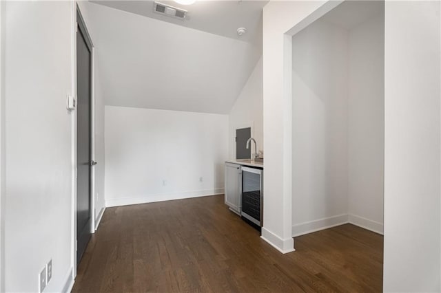 2347 Hosea L Williams Dr NE Unit 11, Atlanta, GA 30317 - bonus room featuring wine cooler, wet bar, dark wood finished floors, and vaulted ceiling