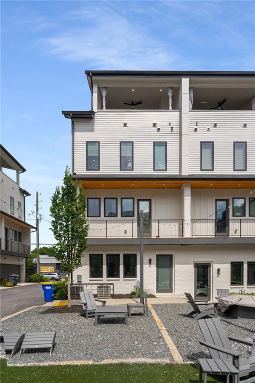 2347 Hosea L Williams Dr NE Unit 11, Atlanta, GA 30317 - back of house with a patio, uncovered parking, and a balcony