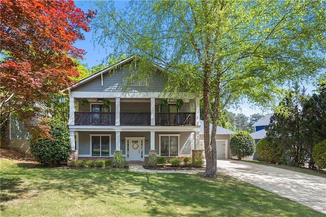 greek revival inspired property featuring a porch, a front lawn, a garage, a balcony, and driveway