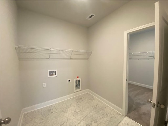 clothes washing area featuring visible vents, baseboards, laundry area, hookup for a washing machine, and hookup for an electric dryer