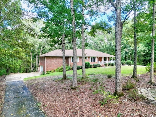 ranch-style home with a front lawn