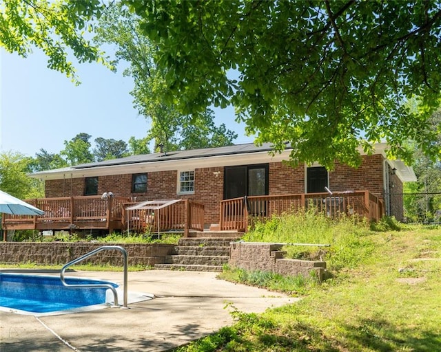 724 Camelot Way, Norcross, GA 30071 - back of house with a wooden deck, a patio area, and brick siding