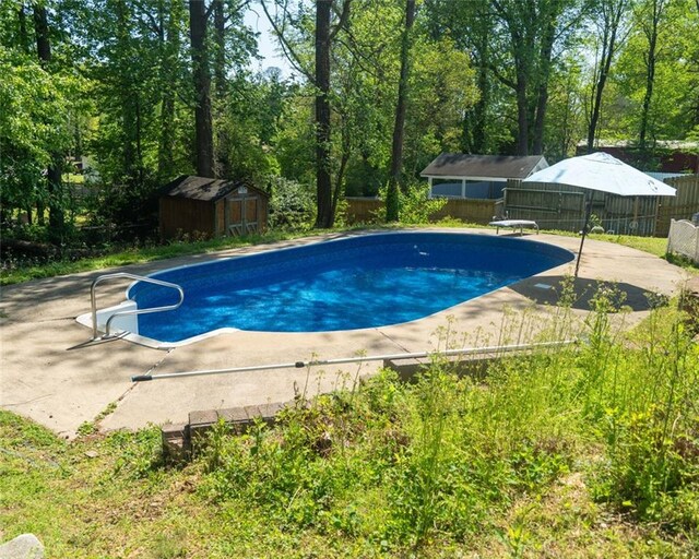 724 Camelot Way, Norcross, GA 30071 - view of pool featuring a fenced backyard, a patio, a shed, and a diving board