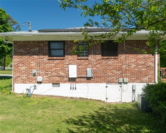 724 Camelot Way, Norcross, GA 30071 - view of property exterior with a lawn, crawl space, solar panels, and brick siding