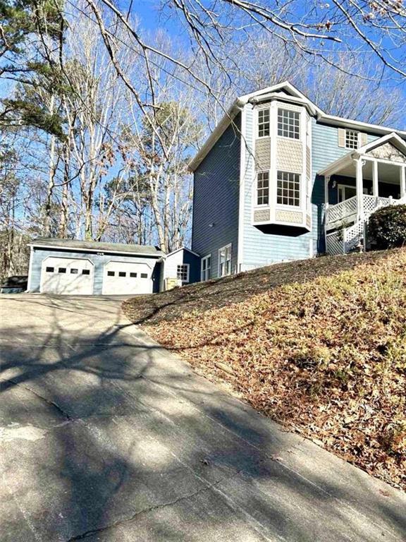 view of side of property featuring a garage