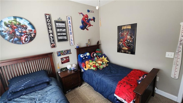 bedroom with carpet and baseboards