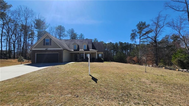 view of front facade with a garage, brick siding, driveway, and a front lawn