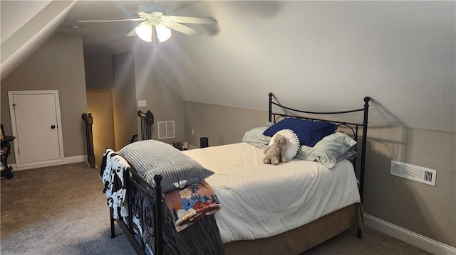 bedroom with carpet floors, baseboards, visible vents, and lofted ceiling