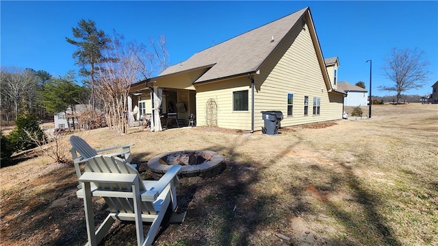 view of side of property featuring a fire pit