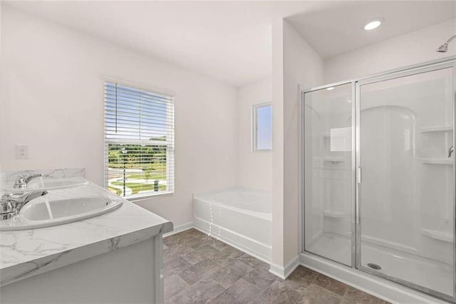 bathroom featuring vanity and plus walk in shower