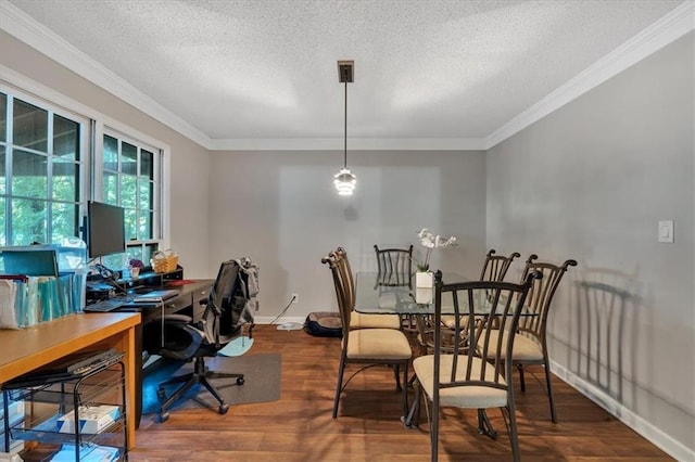 dining space with a textured ceiling, crown molding, and hardwood / wood-style floors