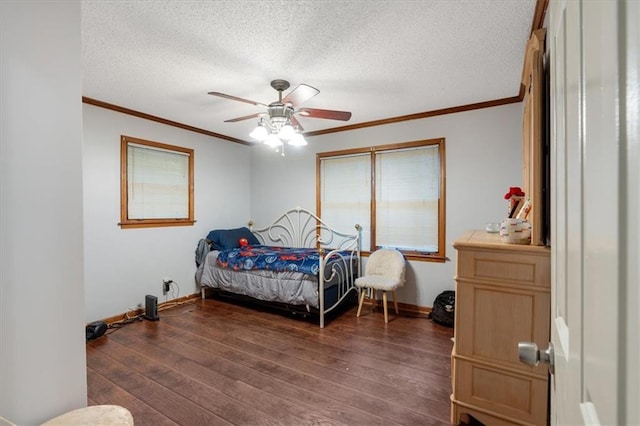 bedroom with ceiling fan, a textured ceiling, and dark hardwood / wood-style floors