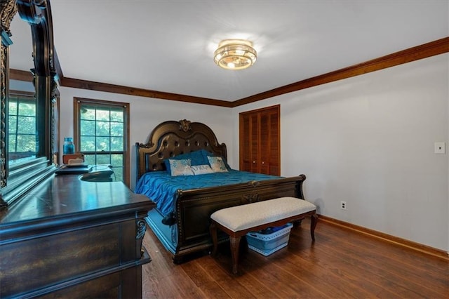 bedroom featuring a closet, dark hardwood / wood-style floors, and ornamental molding