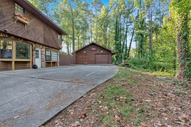 view of side of home with an outbuilding and a garage