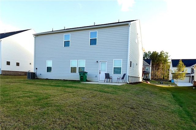 back of property with a patio area, cooling unit, and a yard