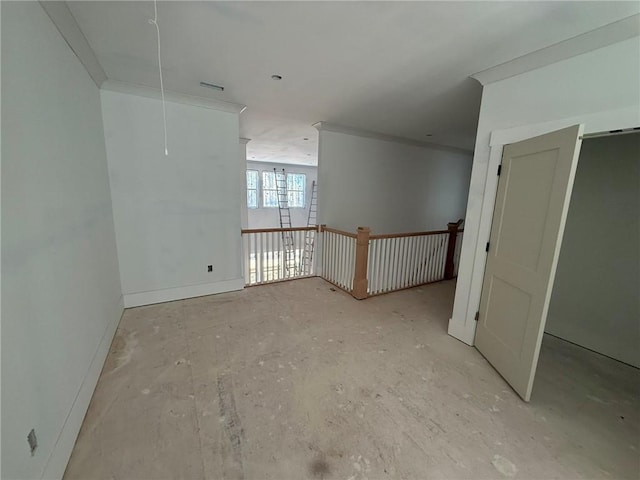 spare room featuring crown molding