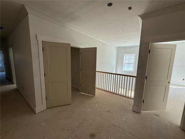 empty room featuring ornamental molding