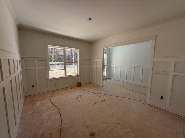 spare room with crown molding