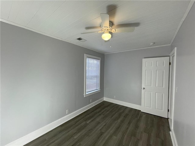 spare room featuring crown molding, ceiling fan, and dark hardwood / wood-style floors