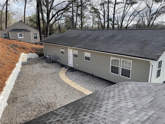 back of house featuring cooling unit