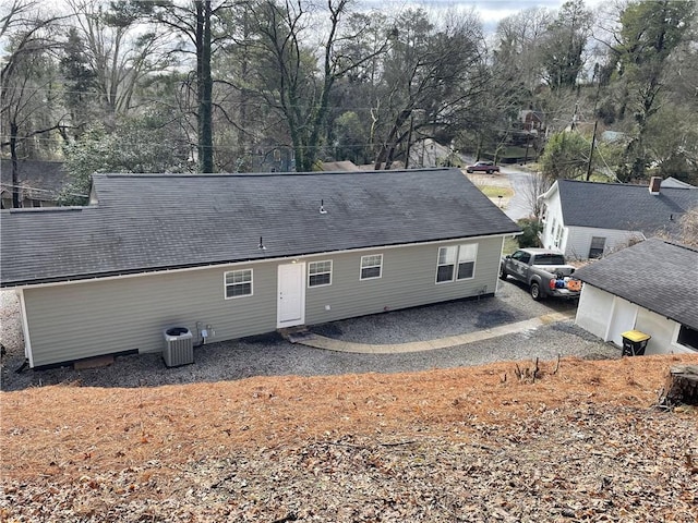 rear view of property featuring central air condition unit