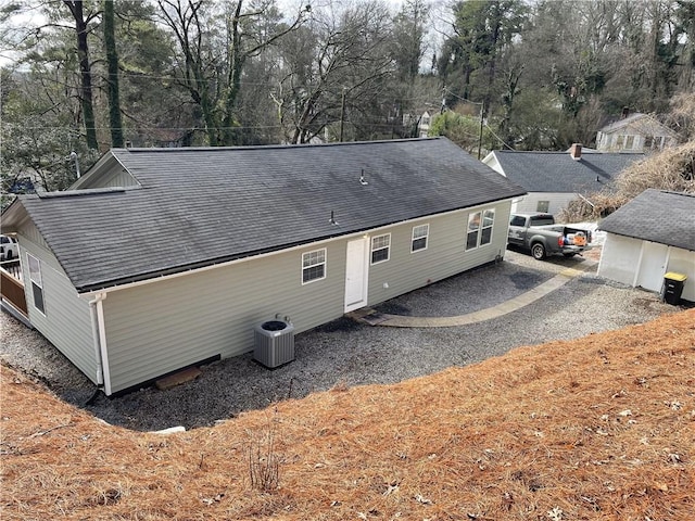 rear view of house with central AC